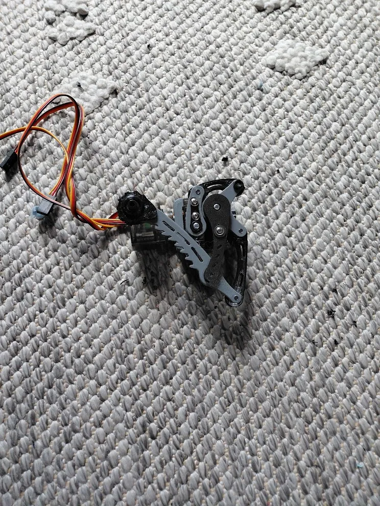 A physical leg mechanism photographed from another angle before the later body revisions.