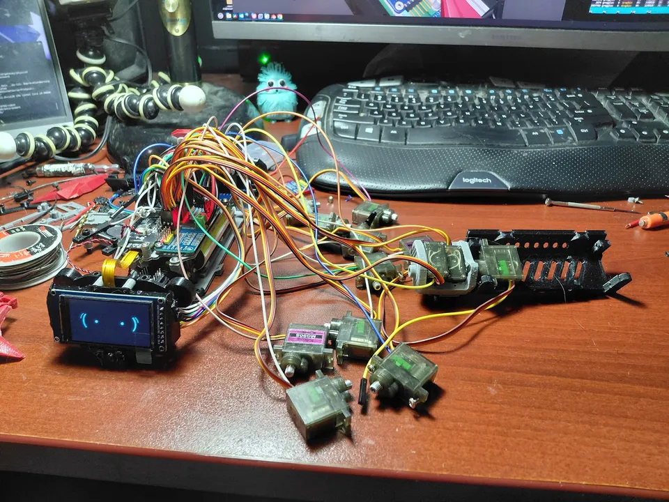 The open body, wiring and servos laid out during the feedback-servo rebuild.